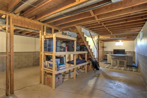 In the lower level you can see there's so much storage space! Or put your design skills to work and this would be a wonderful place to finish!