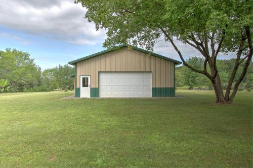 View of pole barn. 30x40 w/ cement floor and electricity