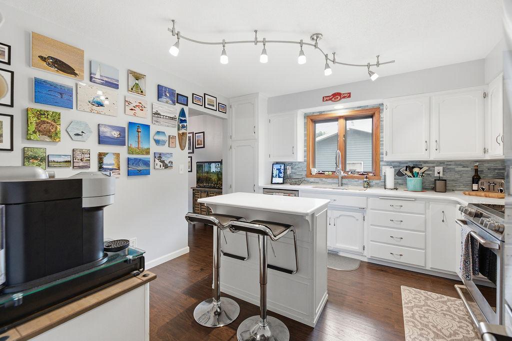 Kitchen island, access to dining, stainless appliances