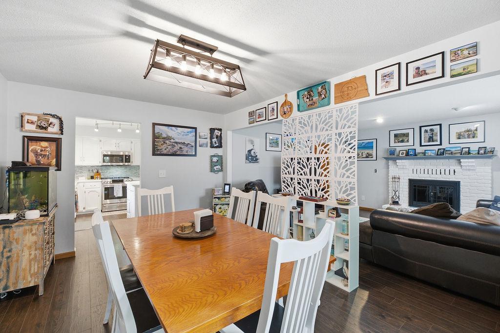 Bright dining room connects to living and kitchen