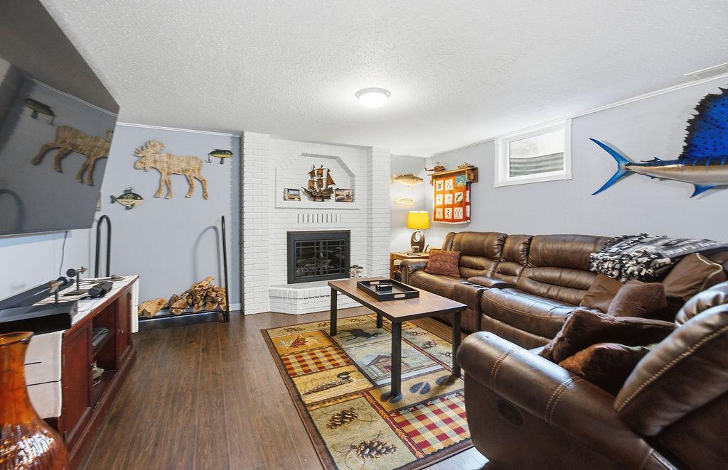 Family Room features a second brick fireplace
