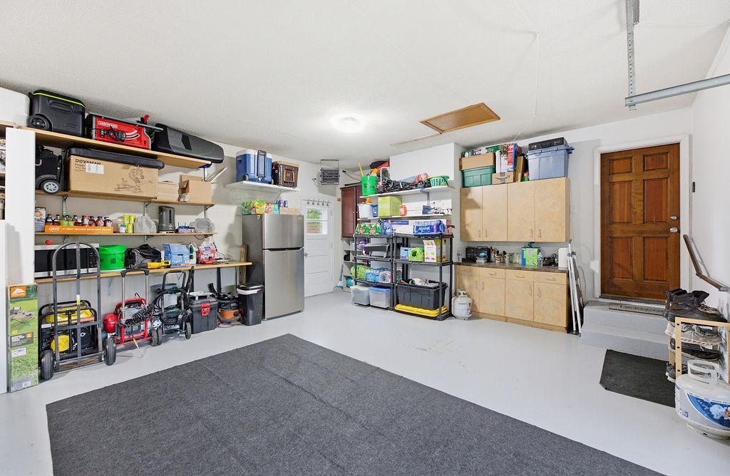 Functional attached garage with storage, great lighting & finishes