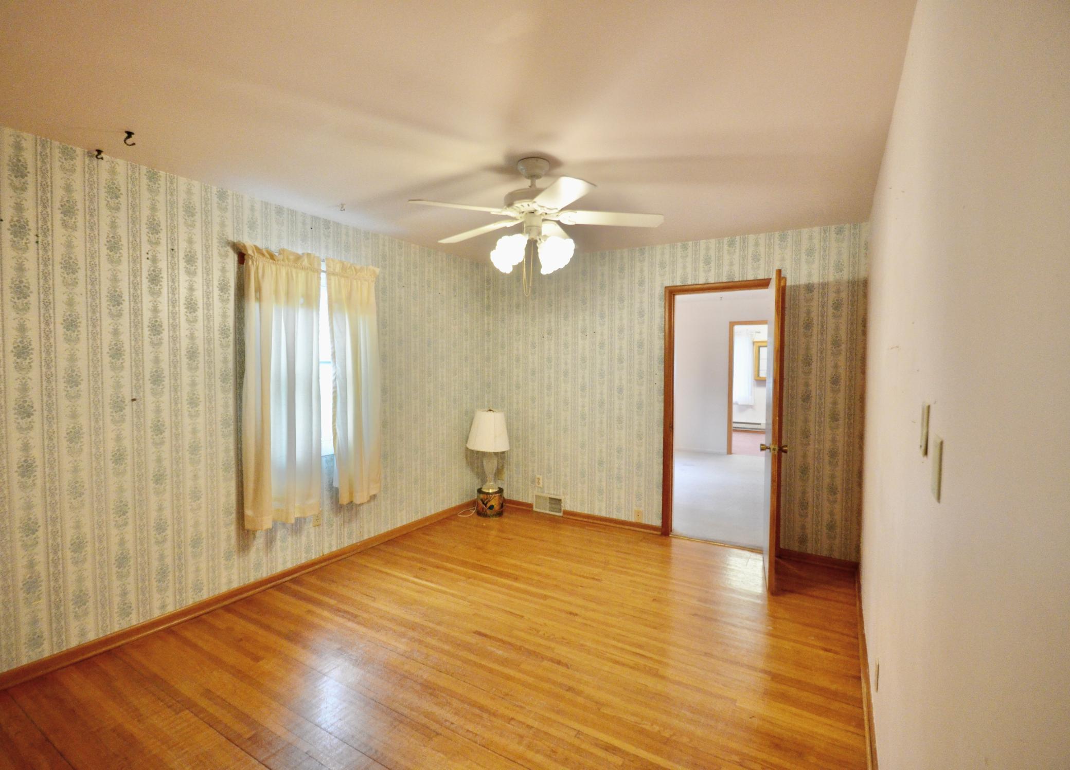 Main Floor Bedroom with hardwood floors