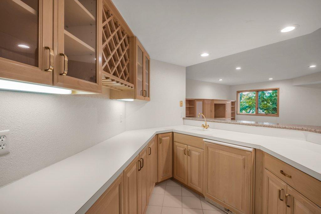 Lower level bar (built-in bar fridge)