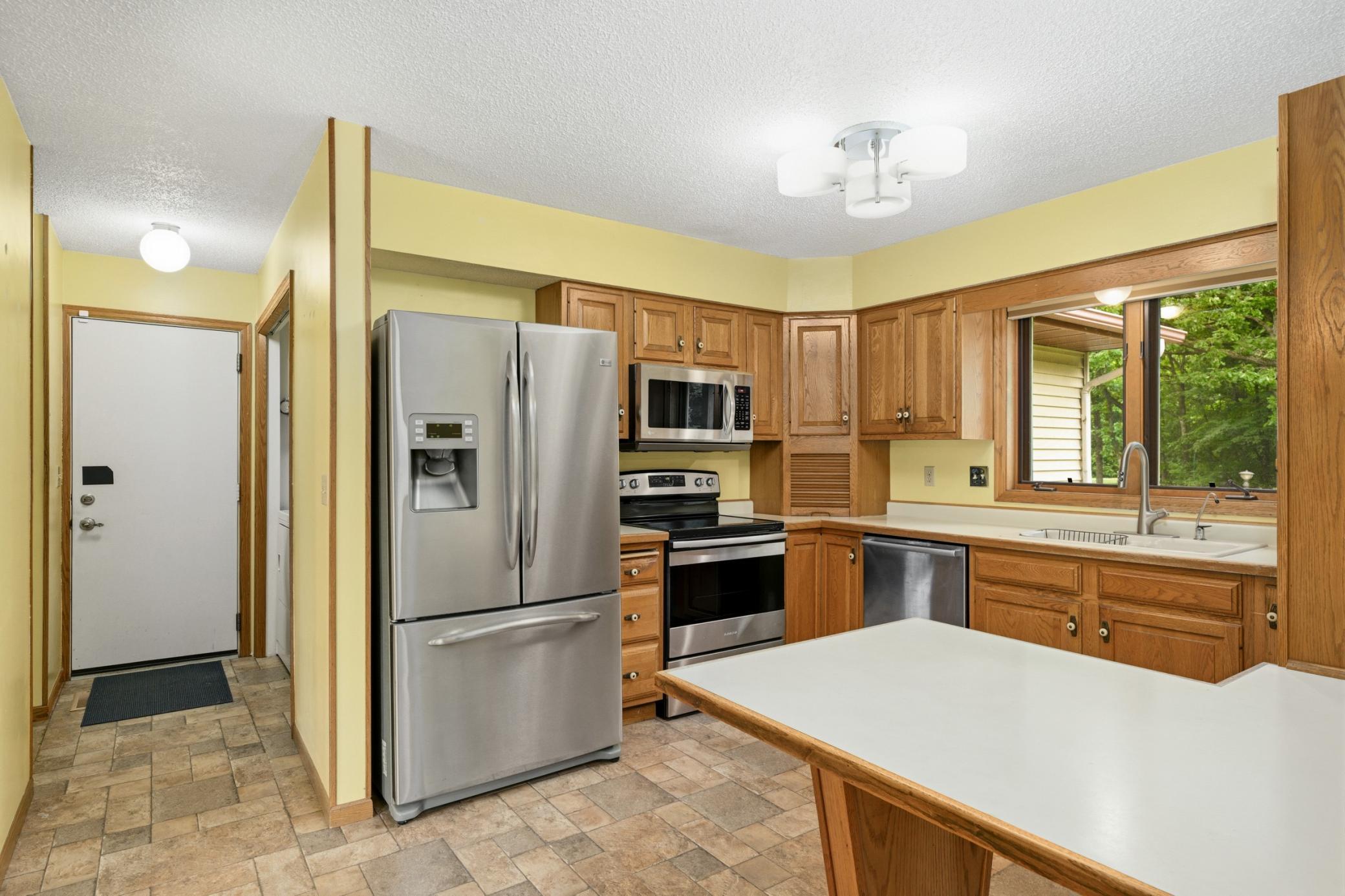 Kitchen has Stainless Steel Appliances & Lots of Cabinet Space.