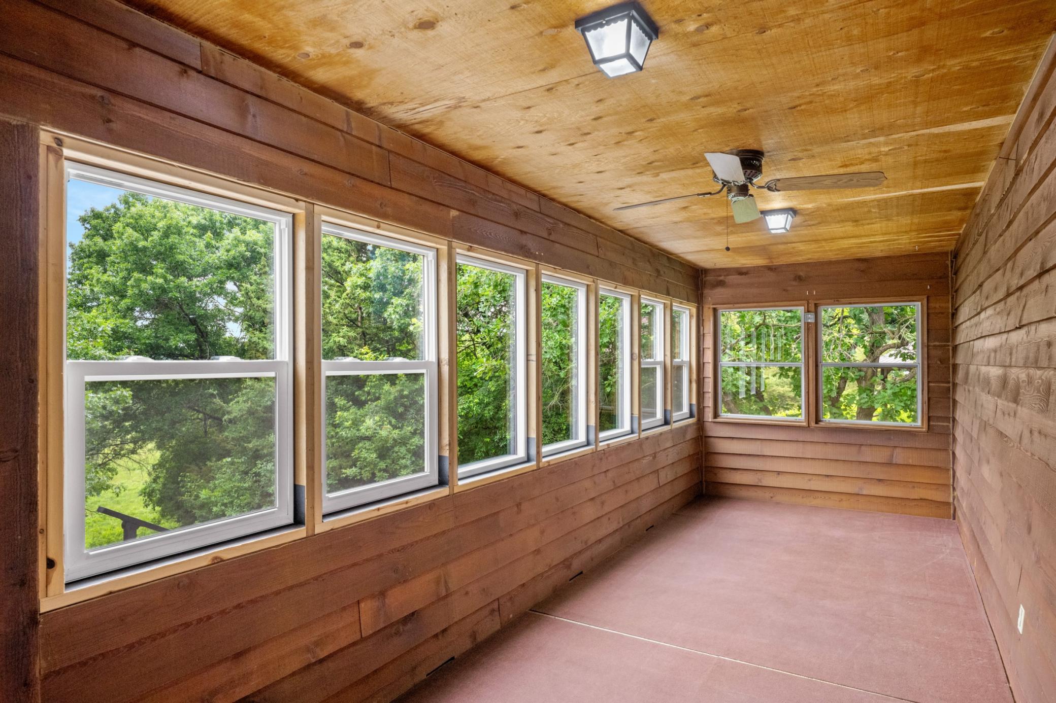 3 Season Porch with Mostly Updated Vinyl Windows.