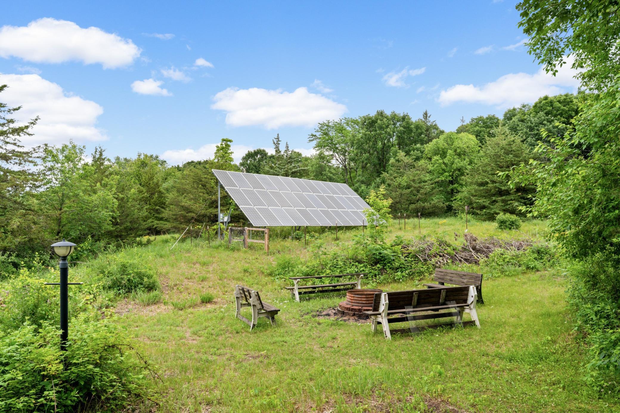 Solar Field in on the Back Side of the Outbuilding. It helps offset much of the homes Electrical Costs.