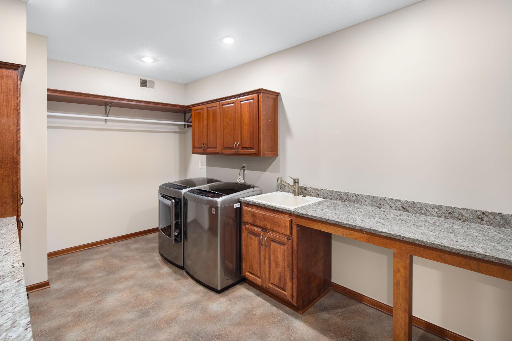 Large lower-level laundry room.