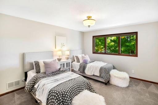 Upstairs, a cozy landing leads to two well-sized bedrooms.