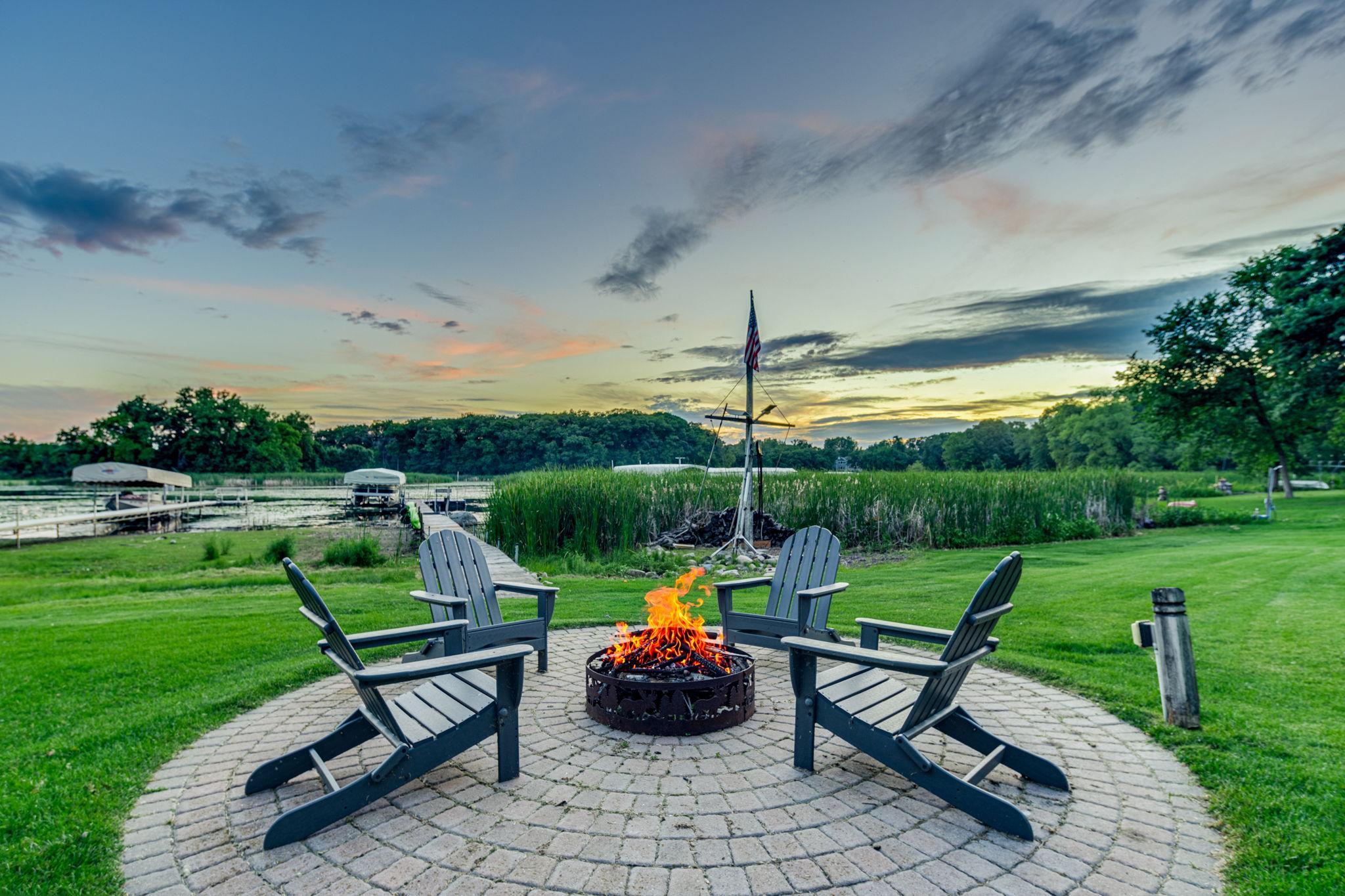 Firepit area perfectly positioned along the shoreline.