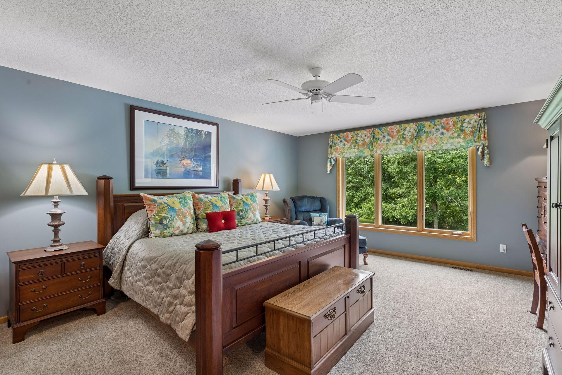 10426 Eagle Pointe Circle - Spacious Primary bedroom. Beautiful tree house views.