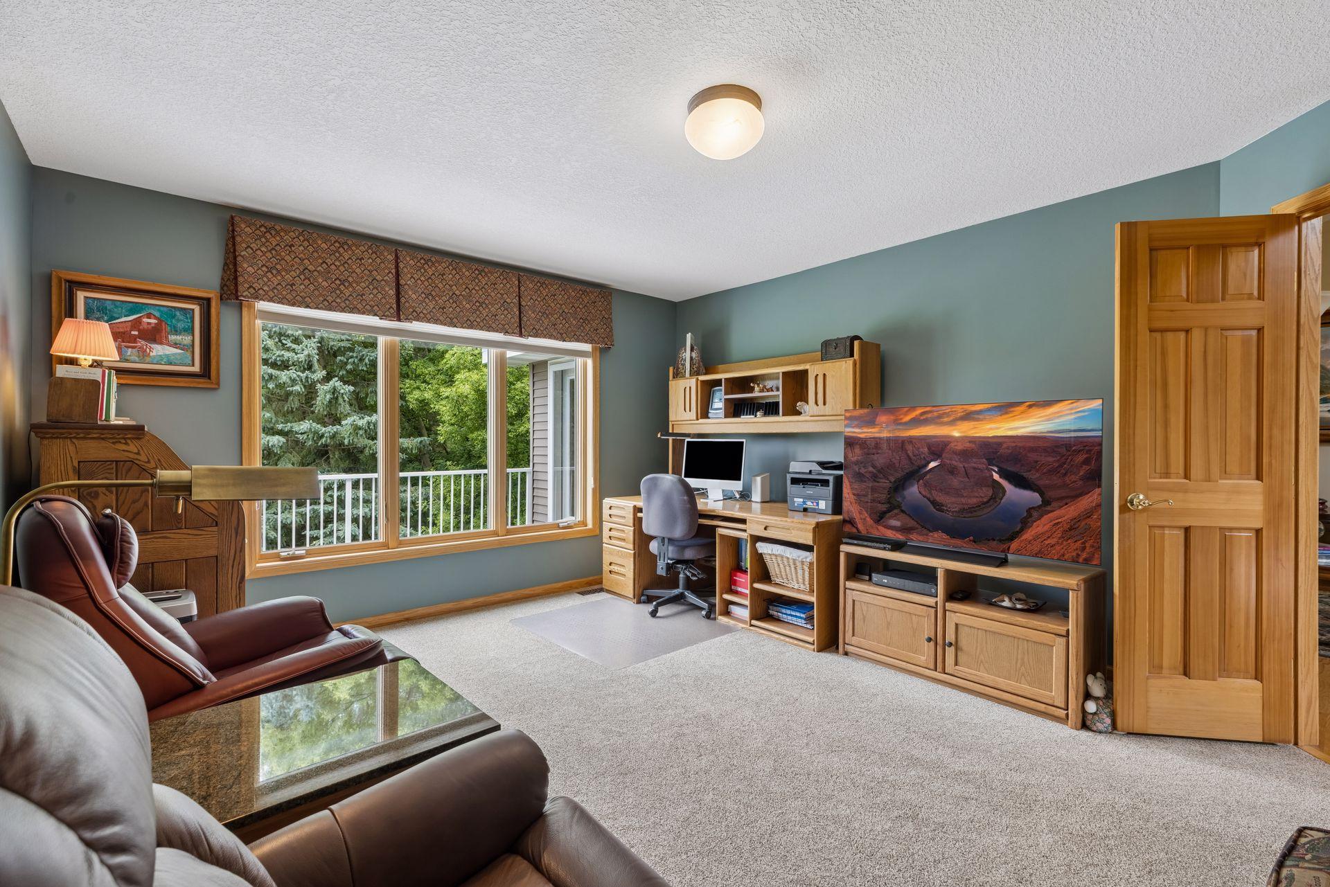 10426 Eagle Pointe Circle - Flex room on the main floor overlooking the balcony.
