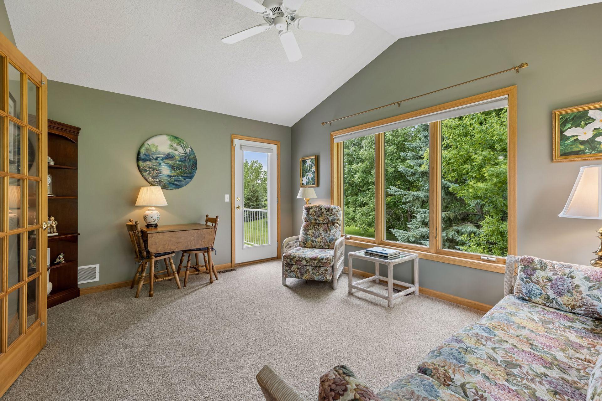 10426 Eagle Pointe Circle - Sunny and relaxing 4 season room. Greenery in every window.