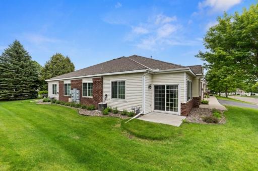 There is a gorgeous sunroom with a nice patio on the side.