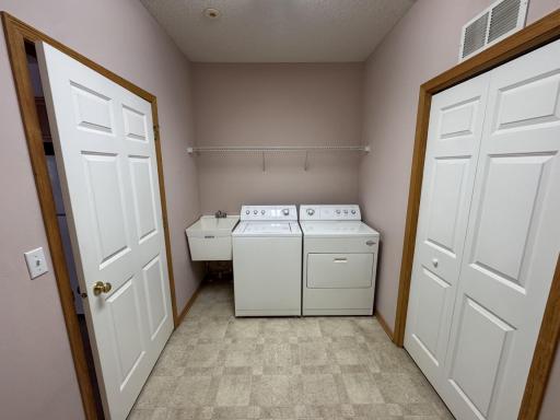 The laundry room doubles as a mudroom from the garage, has a big closet and features a laundry tub too.