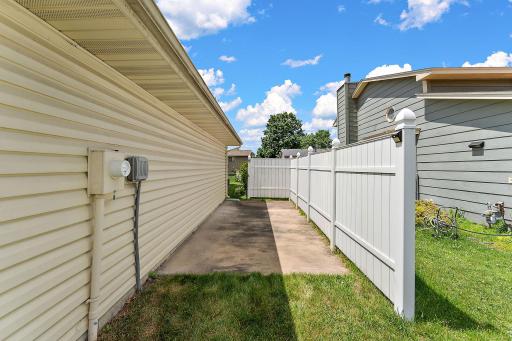 Concrete parking area on the side of the garage