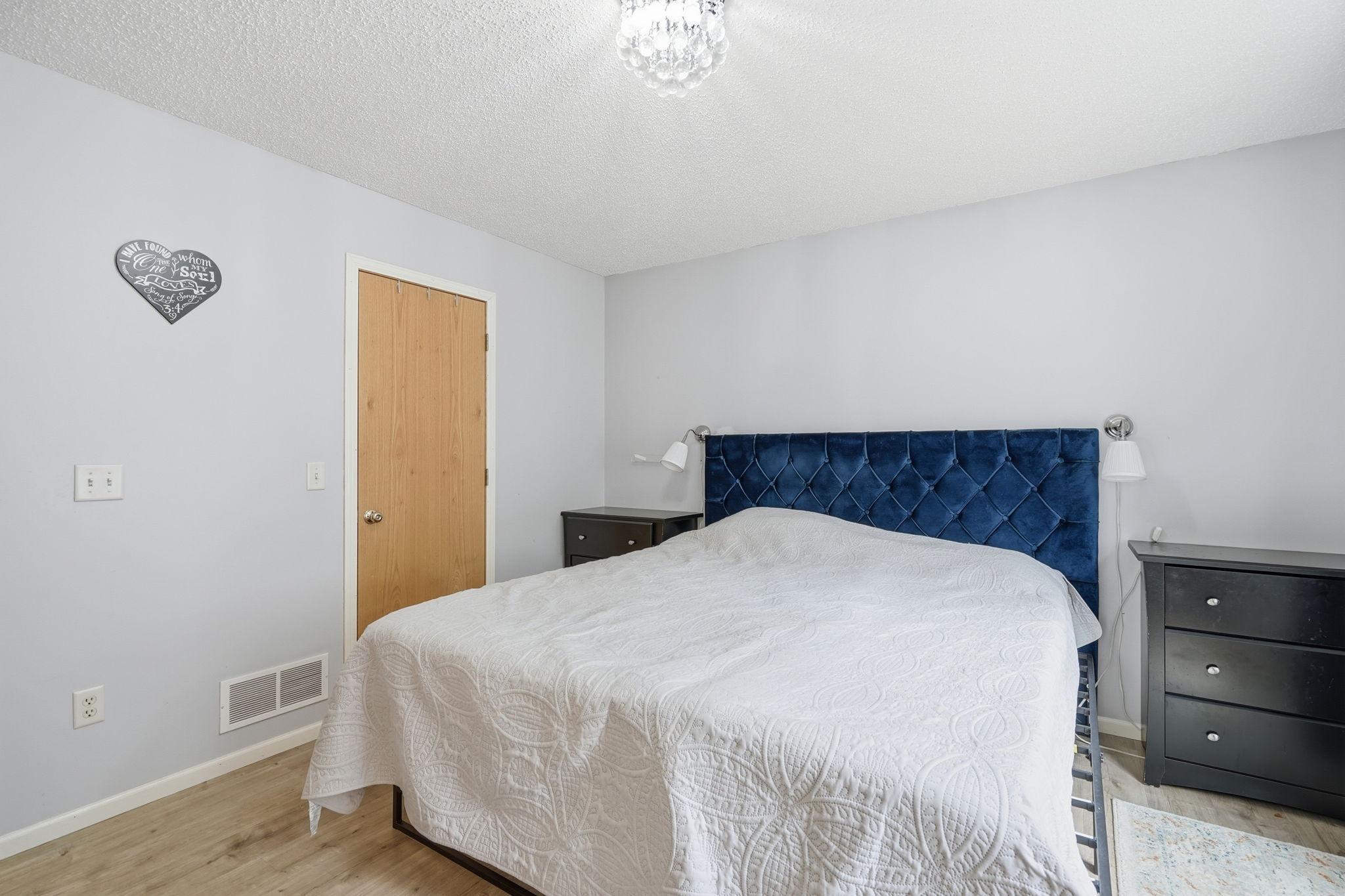 Primary bedroom suite with walk in closet and private bath