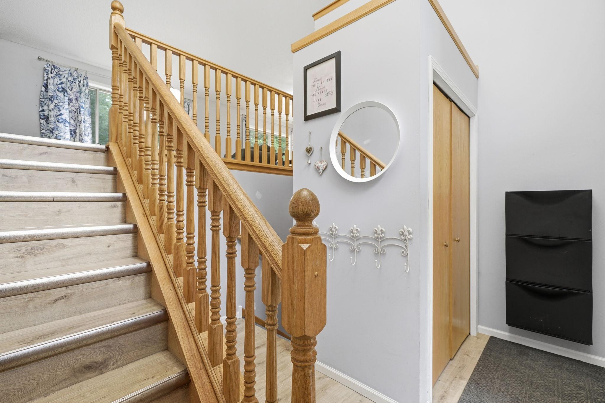 Generously sized foyer with closet and garage entrance