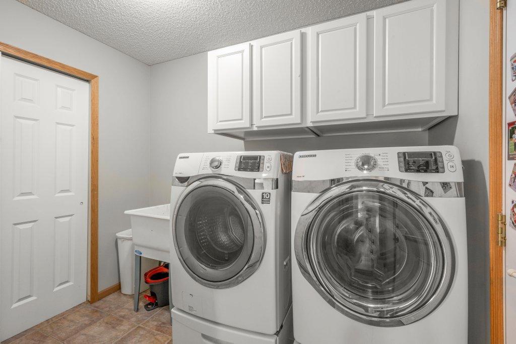 Main Level Laundry Room w/Storage & Sink