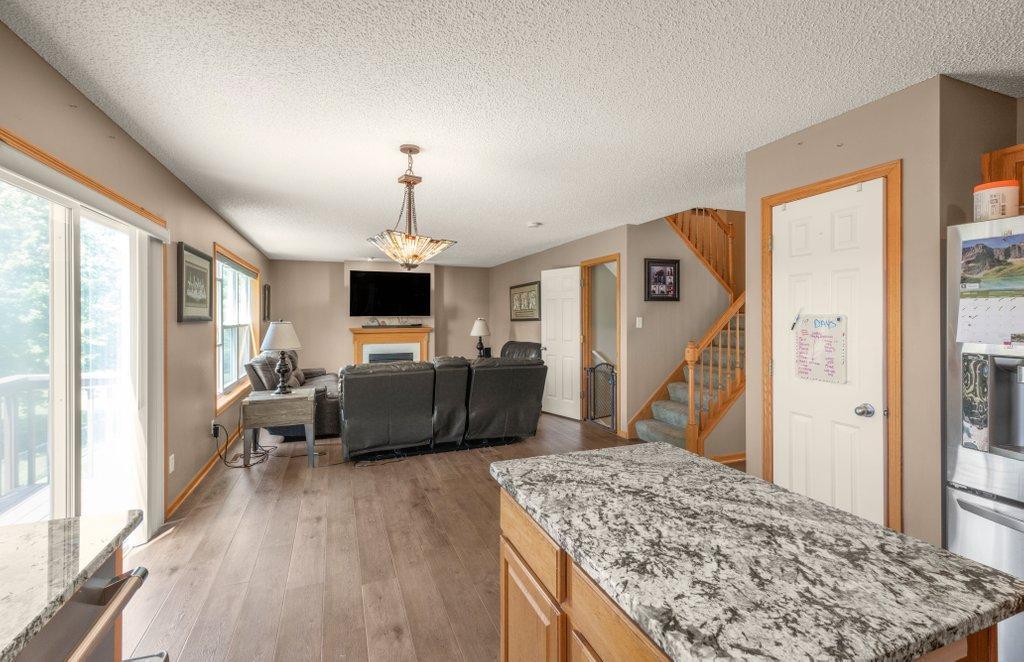 View from the Kitchen into the Family Room, Granite Center Island too.
