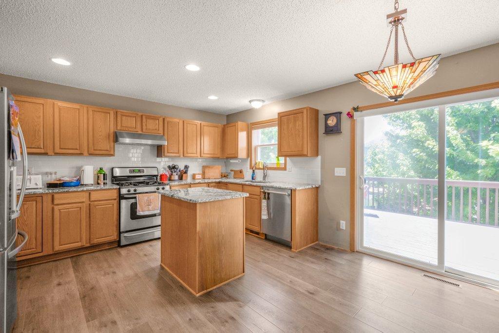 Great Kitchen with Granite Countertops, new Backsplash, and a Walkout to the Deck