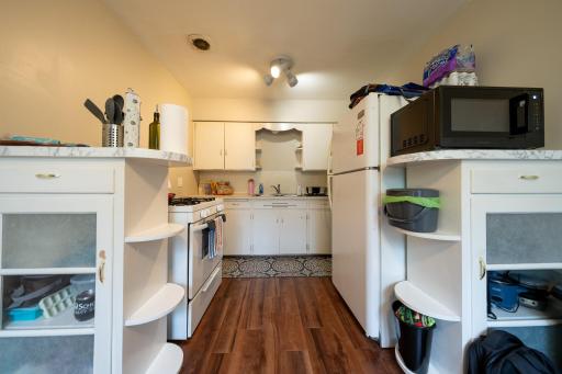 Kitchen with stove, fridge, sink/counter space and built in cabinets