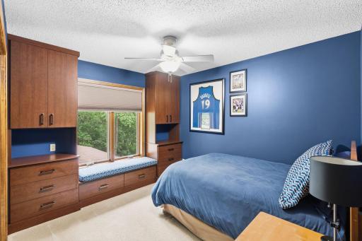 Bedroom includes custom designed closet inserts
