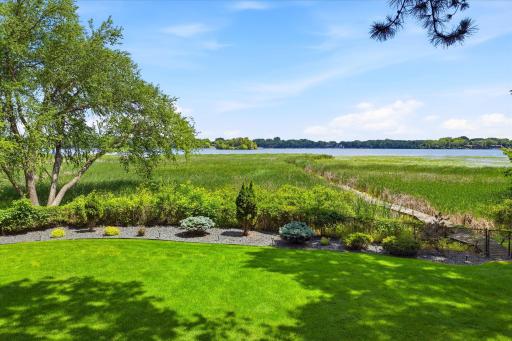 Photo for 12428 54th Avenue N, Minneapolis, MN 55442 - listing #7094336 Gorgeous lake views from your private deck. Level private wooded fully fenced backyard. Enjoy quiet peaceful backyard and lake wildlife. Bass Lake has no public access
