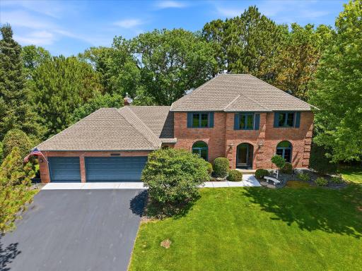 Beautiful curb appeal front brick exterior and hip roof design. Spacious three car garage with plenty of storage space. Beautifully wooded private lot provides your own quiet sanctuary in the city