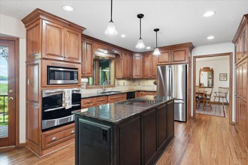 Custom Kitchen remodel by Northland cabinets. Quality cherry cabinets, center island w/pendant lights and granite counter tops