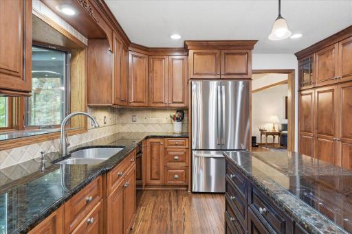 Beautiful cherry cabinets, granite counter tops w/under mount ss sink and pull down faucet and tile backsplash.
brand new GE stainless steel refrigerator