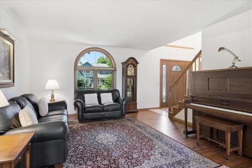 Living Room with hardwood floors and custom rounded arch window
