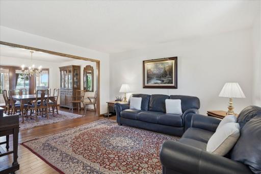 Living Room with hardwood floors and custom rounded arch window