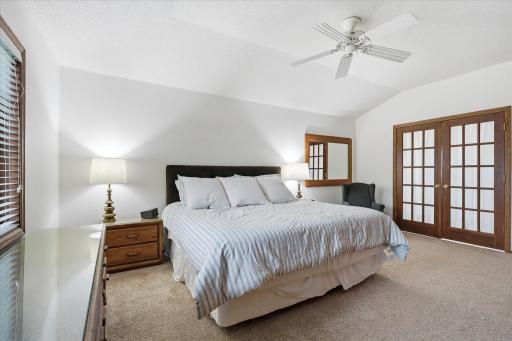 Upper level Primary Bedroom Suite with French doors to Remodeled En Suite Bathroom