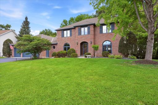Attractive brick front exterior with arched entry design with matching windows for attractive curb appeal. Quality Redwood exterior siding on other three sides