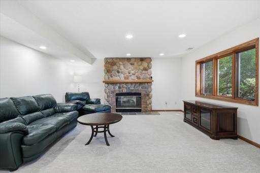 Amusement and exercise Rooms with walk-out patio door to back patio and backyard, cozy gas fireplace w/stone surround. Sellers haven't used fireplace in many years and not sure of condition