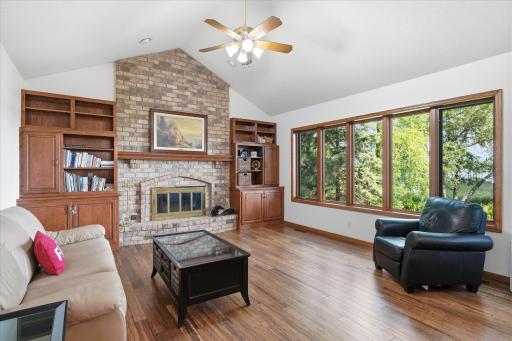Vaulted Family/Great Room with wood burning fireplace w/brick surround, custom built-in cabinets w/hidden Bose speakers (stay). Great lake views. Sellers haven't used fireplace in many years and not sure of condition