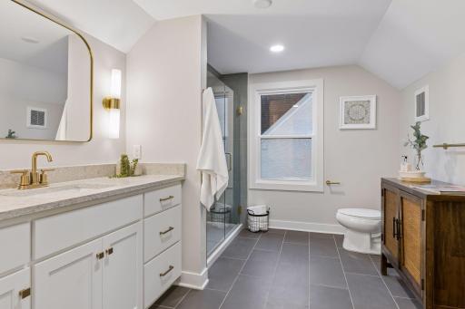 Primary Bath: Heated Tile Floors, Custom Tile Shower, Quartz Countertops, Custom Vanity w/soft close doors + drawers