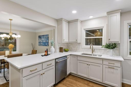 Breakfast Bar, Custom Tile backsplash, New Garbage Disposal, Stainless Steal Sink, New Canned Lighting, New Widows