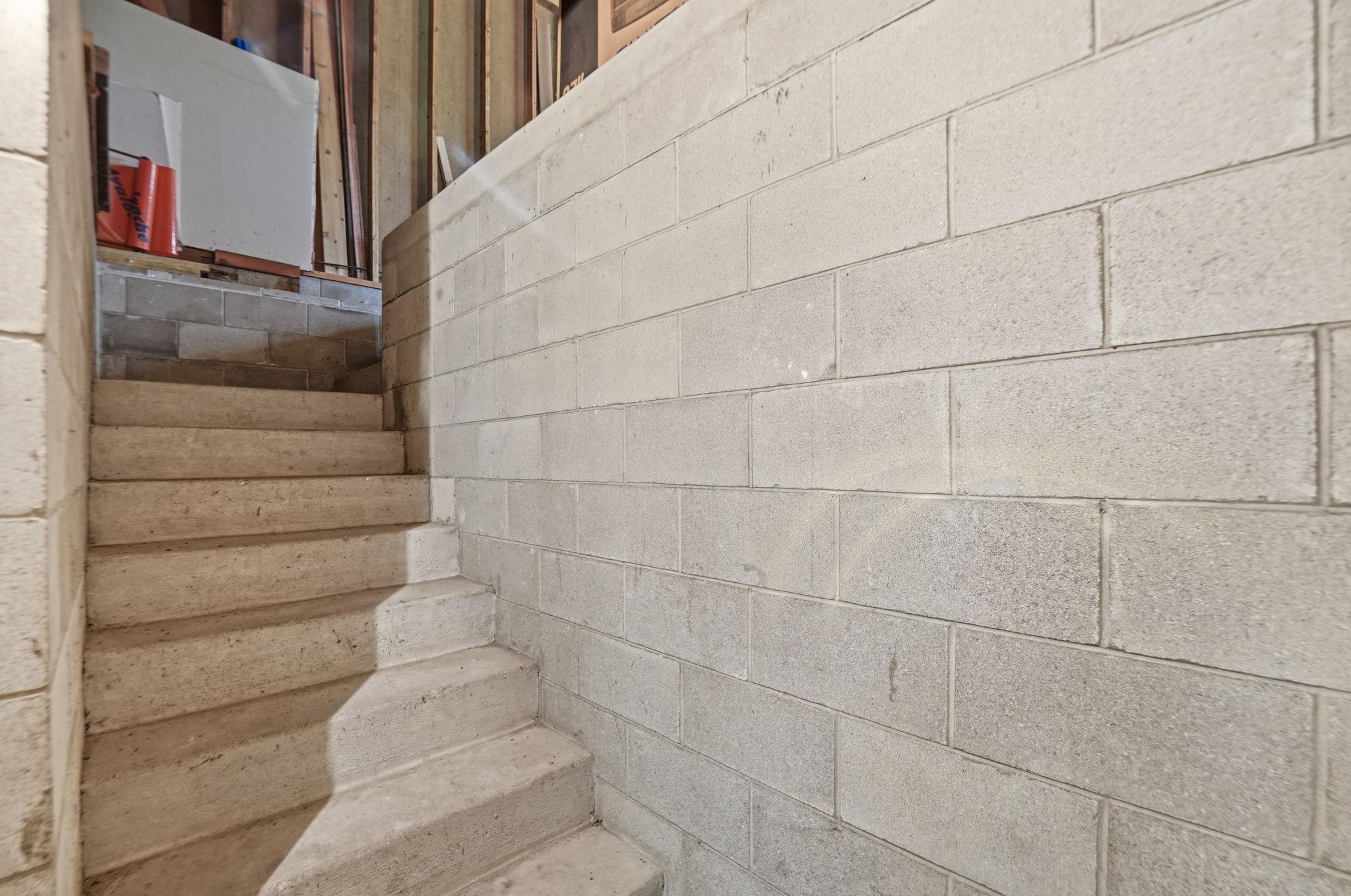 Basement steps leading to the garage
