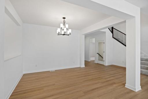 (Photo of a similar home, actual finishes may vary) The dining room is an elegant space designed for elaborate meals and celebrations with friends and family.