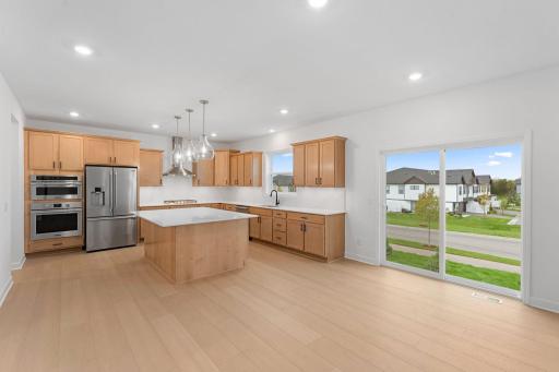 Extensive quartz countertops and a gas range streamline everyday culinary pursuits