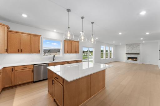 The center island is versatile and ready for preparing home-cooked meals or hosting multiple guests at the breakfast bar