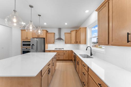 The kitchen is equally stylish and practical with sleek cabinetry, high-end finishes and all-new stainless steel appliances.