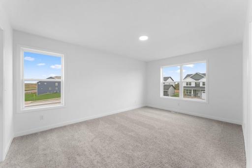 Three secondary bedrooms are situated down the hall from the ownerâs suite on the second floor.