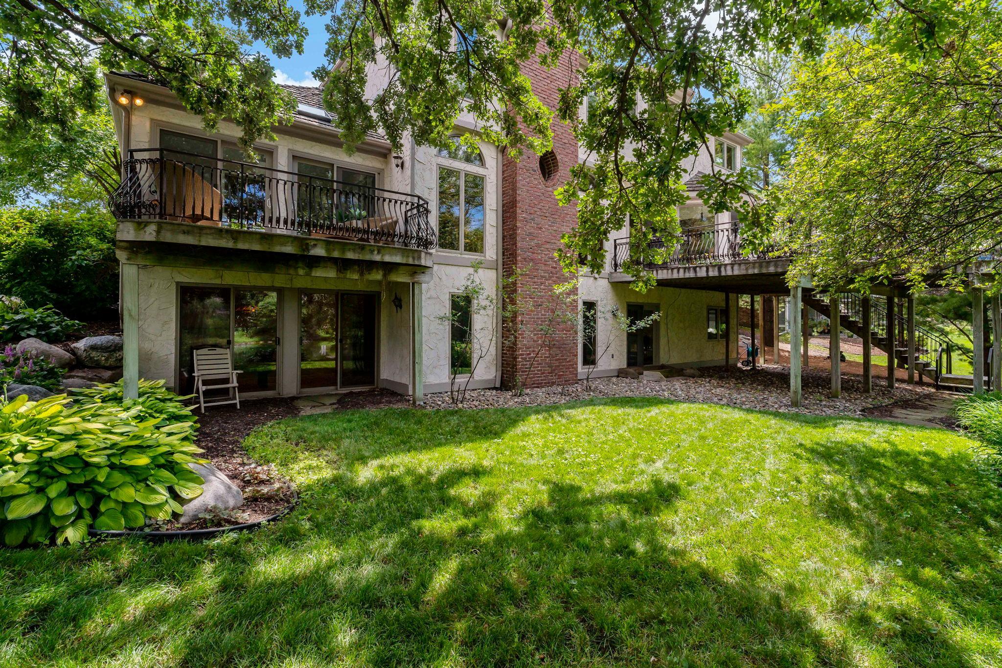 Gorgeous backyard includes traditional lawn, as well as the prairie area
