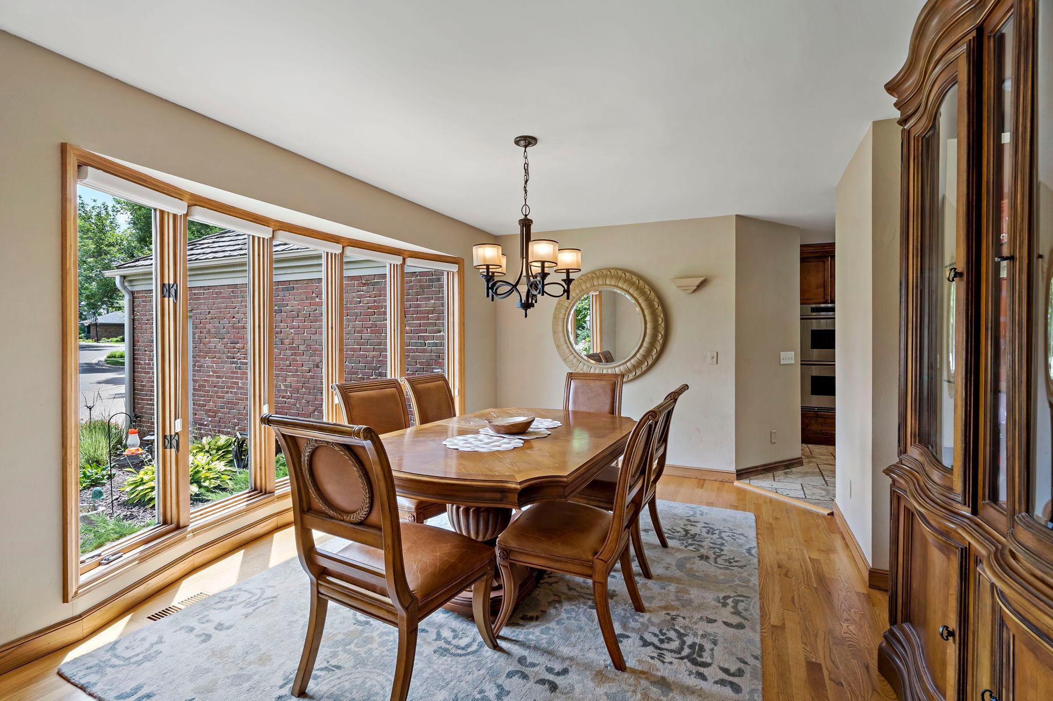 Formal dining room with large windows