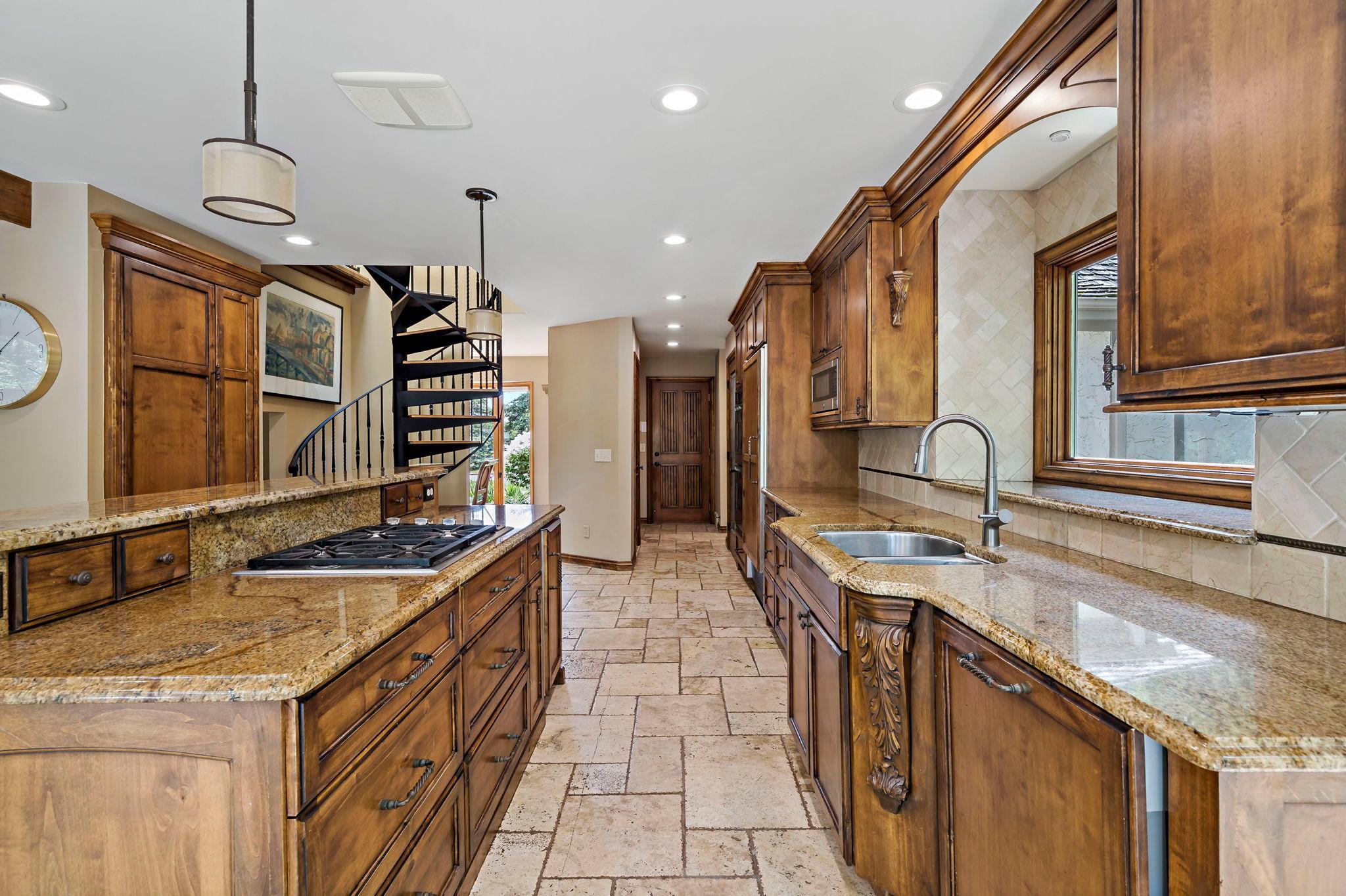 Large kitchen with pantry and island, as well as additional storage throughout