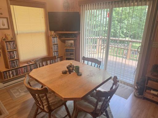 Patio door off the dining room leads to a spacious wraparound deck