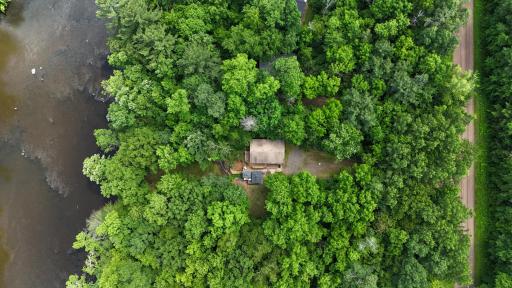This private wooded riverfront property is ready to enjoy
